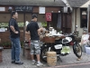 These young men had a mobile cafe on the back of a motorcycle.
